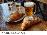 Appetizing Croissants on wooden board near the beer glasses. Generate ai. Стоковое AI-изображение, AI-художник Иван Рябоконь / Фотобанк Лори