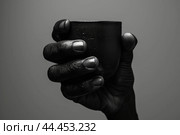 Comforting Black hand holding coffee cup. Generate ai. Стоковое AI-изображение, AI-художник Иван Рябоконь / Фотобанк Лори