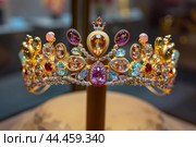 Precious Beautiful gold tiara with gems. Generate ai. Стоковое AI-изображение, AI-художник Иван Рябоконь / Фотобанк Лори
