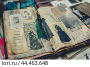 Vintage scrapbook with memories and nostalgia. Стоковое AI-изображение, AI-художник Иван Рябоконь / Фотобанк Лори