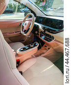 Changan BenBen E-Star is a 5-door city car hatchback. Pink small Changan Benni. Редакционное фото, фотограф Константин Григорьев / Фотобанк Лори