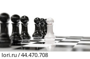 Standing out from Crowd. white pawn standing out from crowd of plenty identical black fellows. Leadership uniqueness independence initiative strategy dissent think different teamwork business success. Стоковое фото, фотограф Павел Муравьев / Фотобанк Лори