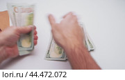 Exploring the intersection of cryptocurrency and cash in contemporary finance. Стоковое видео, видеограф Сергей Толмачёв / Фотобанк Лори