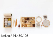DIY concept. Natural materials for craft or needlework. Accessories for crochet and hand embroidery: hoops, set of cotton yarn, crochet hooks, box with wooden beads. Making handmade gifts. Copy space. Стоковое фото, фотограф Виктория Катьянова / Фотобанк Лори