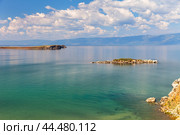 Baikal Lake on sunny summer day. View from Olkhon Island to Small Sea and islet near Kharantsy village, called Crocodile. Cormorants have settled on island. Beautiful summer landscape. Natural background. Стоковое фото, фотограф Виктория Катьянова / Фотобанк Лори