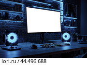 Screen monitor at blue neon light of personal gamer computer in dark living room. Monitor of pc on table at cozy home with modern design is neon lit. Advertising mock-up concept. Copy ad text space. Стоковое AI-изображение, AI-художник Aleksandr Golubev / Фотобанк Лори
