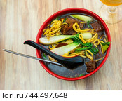 Noodle soup ramen with beef, mushrooms and greens. Стоковое фото, фотограф Яков Филимонов / Фотобанк Лори