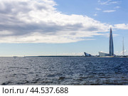 Panoramic waterscape with Lakhta Centre skyscraper on the shore of the Gulf of Kronshtadt in st/ Petersburg (2024 год). Редакционное фото, фотограф Евгений Харитонов / Фотобанк Лори