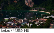 A tropical lagoon filled with many tourist-friendly yachts during the holiday season. Тропическая лагуна с множеством туристических яхт в сезон отпусков. Стоковое видео, видеограф Валерий Тесаков / Фотобанк Лори