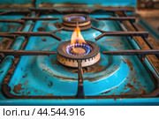 Ignited gas stove burner close-up. Стоковое AI-изображение, AI-художник Иван Рябоконь / Фотобанк Лори