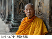Serene buddhist monk meditating by temple wall. Стоковое AI-изображение, AI-художник Иван Рябоконь / Фотобанк Лори