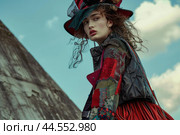 Fashionable woman in avantgarde outfit posing outdoors. Стоковое AI-изображение, AI-художник Иван Рябоконь / Фотобанк Лори