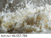 Highspeed capture of milk splashing, creating intricate liquid shapes. Стоковое AI-изображение, AI-художник Иван Рябоконь / Фотобанк Лори