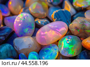 Vibrant collection of opal stones shining in a mesmerizing array of colors. Стоковое AI-изображение, AI-художник Иван Рябоконь / Фотобанк Лори