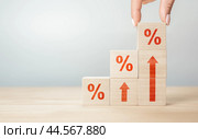 Monetary Inflation. ladder of cubes with percent sign and arrows indicating an increase in inflation. sale price and tax rise concept. Inflation, hyperinflation. Стоковое фото, фотограф Павел Муравьев / Фотобанк Лори