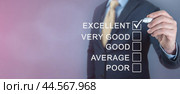 Businessman giving excellent feedback rating as oppose to five option Good, Average and Poor ratings. copy space. Customer satisfaction rating. Excellent experience. copy space. Стоковое фото, фотограф Павел Муравьев / Фотобанк Лори