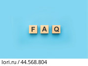 FAQ frequently asked questions text on wooden cubes. blue background. information, problem and solution concepts. FAQ abbreviation. Стоковое фото, фотограф Павел Муравьев / Фотобанк Лори