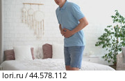 Inflammation of appendicitis, stomach ulcer, bloating, man with abdominal pain suffering at home, symptoms of gastritis, diseases of the digestive system, health problems concept. Стоковое видео, видеограф Станислав Тарко / Фотобанк Лори