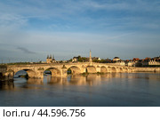 View of the embankment with ancient houses and the Jacques Gabriel Bridge over the Loire River on a sunny summer day, Blois, Loire and Cher, France. Стоковое фото, фотограф Ula Ulachka / Фотобанк Лори