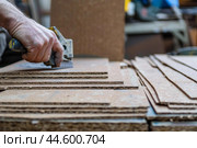 Carpenter cutting particleboard in workshop. Стоковое AI-изображение, AI-художник Иван Рябоконь / Фотобанк Лори