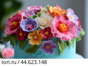 Colorful fondant flowers on cake. Стоковое AI-изображение, AI-художник Иван Рябоконь / Фотобанк Лори