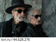 Stylish senior couple in avantgarde fashion. Стоковое AI-изображение, AI-художник Иван Рябоконь / Фотобанк Лори