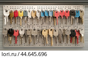 Key holder organizing keys for apartment building security. Стоковое AI-изображение, AI-художник Юрий Поздников / Фотобанк Лори