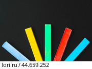 Colorful chalks close up on black background. Стоковое фото, фотограф Сергей Толмачёв / Фотобанк Лори