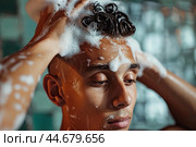 Man enjoying a refreshing shampoo. Стоковое AI-изображение, AI-художник Иван Рябоконь / Фотобанк Лори