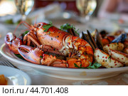 Delicious lobster lying on a plate with mussels and shrimps. Стоковое AI-изображение, AI-художник Иван Рябоконь / Фотобанк Лори