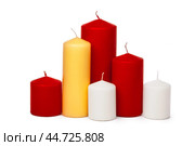 different size and colors candles isolated on a white background. Стоковое фото, фотограф Сергей Толмачёв / Фотобанк Лори