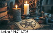 A mystical altar setup featuring candles, crystals, and an intricate pentagram design during twilight in a dimly lit room. Стоковое AI-изображение, AI-художник Сергей Толмачёв / Фотобанк Лори