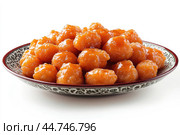 Delicious Tatar chak-chak served on a plate isolated on a white background. Стоковое AI-изображение, AI-художник Veniamin Kraskov / Фотобанк Лори