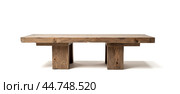 Rustic Wooden Table for Product Display, Sturdy Rectangular Top, Thick Legs, Neutral Background, Natural Texture, Merchandise Presentation, Minimalist Design. Стоковое фото, фотограф Павел Муравьев / Фотобанк Лори