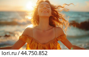 Happy young woman enjoying the sunset on the beach with her arms wide open, smiling and feeling free,  bathed in warm golden sunlight. Стоковое AI-изображение, AI-художник Anastacia Gaikova / Фотобанк Лори