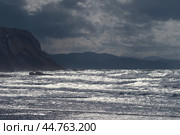 Fantastic picturesque seascape of Itzurun beach in Zumaia in Basque Autonomous Community country in summer day. Concept of the beauty in nature. Noise of the ocean in the image. Стоковое фото, фотограф YuryKara / Фотобанк Лори