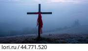 Wooden cross with red fabric in foggy background, concept of spirituality. Стоковое AI-изображение, AI-художник Анастасия Золотницкая / Фотобанк Лори