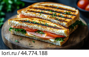 Grilled sandwich with fresh vegetables and melty cheese on a wooden cutting board. Стоковое AI-изображение, AI-художник Юлия Гапеенко / Фотобанк Лори