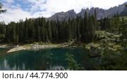 Beautiful lake and mountain view in Dolomites, Lago di Carezza, Italy. Стоковое видео, видеограф Яков Филимонов / Фотобанк Лори