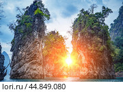 Incredible sunset Khao Sok National Park, Thailand. Cheow Lan lake Famous attraction adventure place travel Thailand. Asia holiday vacation trip. Стоковое фото, фотограф Павел Муравьев / Фотобанк Лори