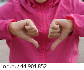 Sign language. Thumb down. Стоковое фото, фотограф YuryKara / Фотобанк Лори
