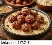 Meatballs are a meat or fish dish, a hot appetizer or a second course. They are balls the size of a walnut to a small apple made of meat or fish cutlet mass or chopped mass mixed with steamed rice. Стоковое AI-изображение, AI-художник Сергей Елизарьев / Фотобанк Лори