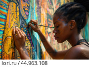 A woman artist creating a vibrant mural that pays homage to African culture and history. Стоковое AI-изображение, AI-художник Veniamin Kraskov / Фотобанк Лори
