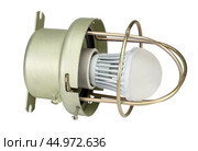 Осветительная лампа с защитным металлическим кожухом на белом фоне. A lighting lamp with a protective metal casing isolated over white background. Стоковое фото, фотограф Татьяна Д / Фотобанк Лори