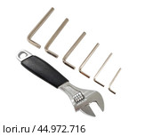 Разводной гаечный ключ на белом фоне. An adjustable wrench on a white background. Стоковое фото, фотограф Татьяна Д / Фотобанк Лори