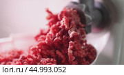 Freshly Ground Meat which is processed from a Kitchen Meat Grinder for various uses. Стоковое видео, видеограф Ольга Коваленко / Фотобанк Лори