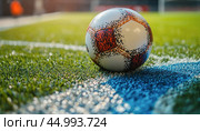 Soccer ball on the line of a sports stadium pitch with dramatic lighting. Стоковое AI-изображение, AI-художник Юрий Поздников / Фотобанк Лори