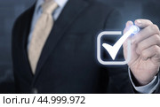 Hand holds green icon Check mark,Check Mark Sign, Tick Icon,right sign,circle green checkmark button,Done.On dark background.Banner.Copy space. Place for text. Стоковое фото, фотограф Павел Муравьев / Фотобанк Лори