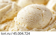 Creamy vanilla ice cream scoop resting on a textured background with flecks of vanilla bean showing delicious richness and texture. Стоковое AI-изображение, AI-художник Сергей Толмачёв / Фотобанк Лори