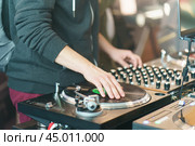 Photography of the modern premium stage mixed board / desk with vinyl turntable and vinyl plate. Close frontal view. Стоковое фото, фотограф YuryKara / Фотобанк Лори